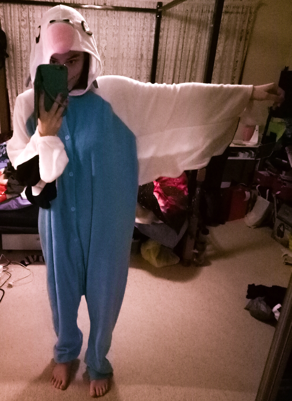 Jessica wearing the blue budgie onesie and taking a selfie